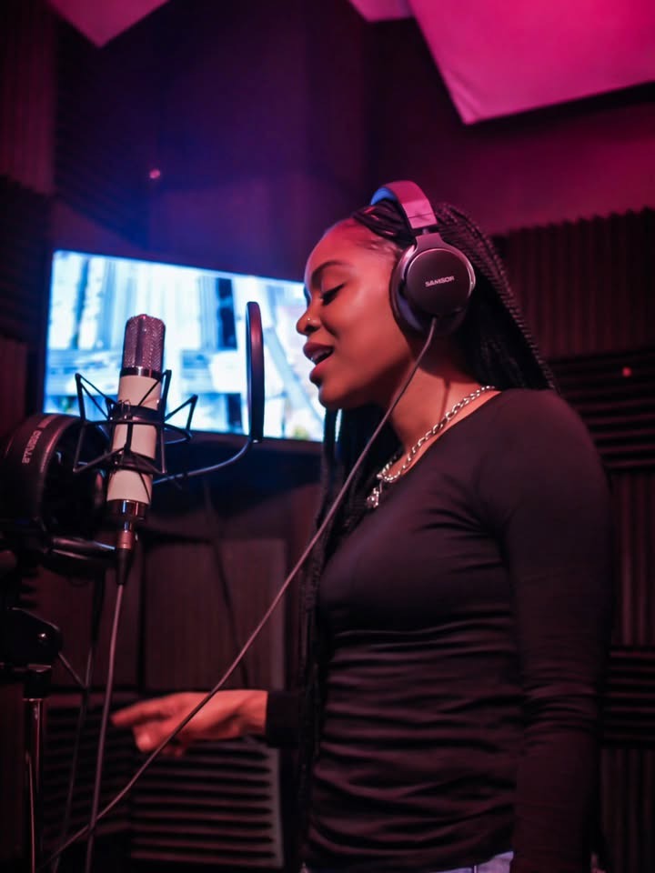 Vocalist recording in the Studio A booth